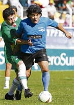 Argentine soccer great Diego Maradona controls the ball during a friendly soccer match in La Paz on Monday. Maradona visited Bolivia to support Bolivia against FIFA, who recently introduced a ban on international soccer matches over 2,750 m (9,022 feet) above sea level without acclimatisation. La Paz is situated at 3,600 metres above sea level. 