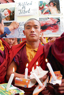 Monks take out a candlelight procession in Shimla on Wednesday in protest against the killings in Tibet. 