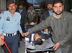 The injured being rushed to hospital after a blast rocked Exhibition Crossing in Srinagar on Wednesday.