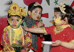 Tiny tots of Maple Bear Canadian Playway and Nursery School play Holi with fellow students on Wednesday in Ludhiana.