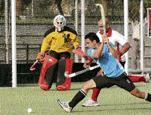 Players of IOC and Air India in action during the semifinal match of the 5th All-India Guru Gobind Singh Gold Cup Hockey Tournament at PAU, Ludhiana, on Wednesday. 