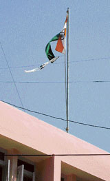 A torn National Flag was found fluttering atop the Mandi DCs office on Wednesday.