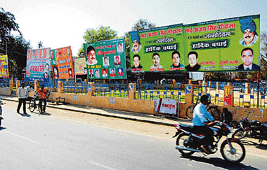 Political hoardings installed in front of Ambedkar Park in Fatehabad.