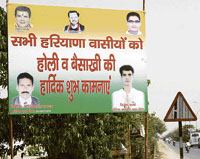 A political hoarding installed along National Highway No. 1 in Panipat.