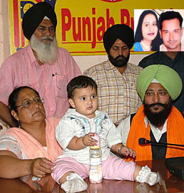 Jagjobanjit Kaur with her maternal grandparents and Lok Bhalai Party senior vice-president Avtar Singh Mullanpuri at a press conference in Jalandhar on Thursday. (Inset) Kids parents Ramneek Kaur, Ranjit Singh.