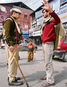 A CRPF soldier performs stop and search operations in Srinagar on Thursday, a day after a blast rocked the city