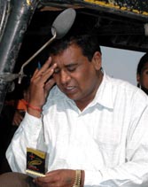 Punjabi lyricist Lal Athouli Wala pens his verses as he waits for passengers in his autorickshaw near Phagwara railway station.