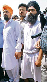 Two men of Babbar Khalsa International  Jaswant Singh, alias Kala (L), and Surender Singh, alias Fauzi  from Jalandhar being produced at a court in New Delhi on Thursday.