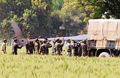 Army personnel load the wreckage of the UAV into a truck at Bhucho Kalan village near Bathinda on Thursday.