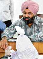 SSP R.S. Khatra addresses a press conference after the seizure of smack in Mohali on Friday.