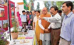 Chief Minister P.K. Dhumal goes round stalls at a kisan mela in Sujanpur Tihra.