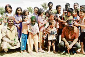 Kids at an SoS village celebrate Holi on Friday. The village takes care of about 128 orphans by providing them a family environment.