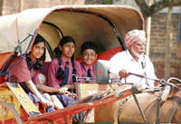 Students of Wylie Memorial School enjoy a ride on a horse cart on the school premises in Ludhiana.