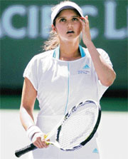 Sania Mirza reacts to a lost point in her fourth round match against Slovakias Daniela Hantuchova at the Pacific Life Open at the Indian Wells Tennis Garden, California.