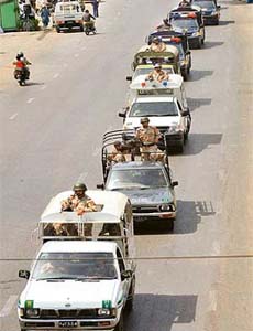 Pakistani paramilitary soldiers and police patrol on a street as Muslims celebrate Id-e-Milad-un-Nabi, the birthday of Prophet Mohammed, in Karachi