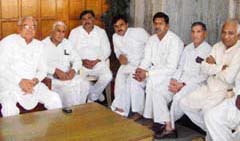 Former Chief Minister Bhajan Lal with his supporters at his residence in Hisar on Sunday after anointing son Kuldeep Bishnoi as his political successor. 