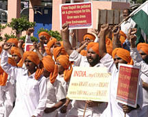 Residents raise patriotic slogans to mark the Martyrdom Day of Shaheed-E-Azam in Khatkar Kalan on Sunday.