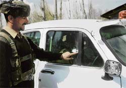 A security jawan points to a gunshot after the encounter at Tealbal Shalimar, on the outskirts of Srinagar on Sunday.