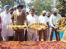 Chief Minister Parkash Singh Badal pays floral tributes at the samadhi of Shaheed Bhagat Singh, Rajguru and Sukhdev at the National Martyrs Memorial, Hussainiwala, Ferozepur, on Sunday.