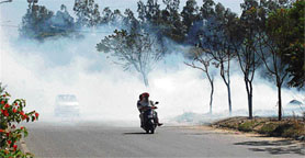 Smoke affects visibility on the Balongi-Kharar road. 