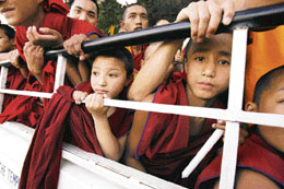 Tibetans on their way to participating in a candlelight vigil at Dharamsala on Monday.