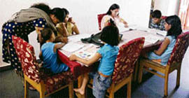 Mothers take care of children in SoS village in Jammu