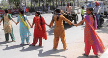Protesters block the road outside the burial ground in Mohali on Tuesday.