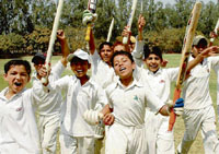 Players of Edmund Rice Cricket Academy after winnng the Under-12 Quadrangular Challenger Trophy at St Johns grounds in Chandigarh on Tuesday.