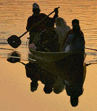 A family enjoys a shikara ride on the Dal Lake in Srinagar.