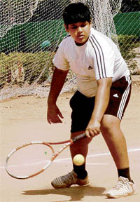 Bhavya Jain plays a shot during the 4th Sh L.D. Kapoor Memorial Total Tennis Championship at YMCA, Sector 11, in Chandigarh on Wednesday. 