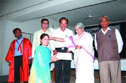 Health minister Lakshmi Kanta Chawla presents degree to a girl student in Batala.