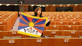 An unidentified European Parliament deputy lays a Tibetan flag in front of her on Wednesday during a session of the European Parliament in Brussels. Cohn-Bendit called EU countries to boycott the Beijing Olympics opening ceremony. 