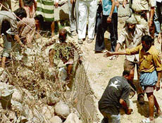 Work in progress to rescue the child, who was buried under stones of Ghaggar wall that caved in in Panchkula on Friday.