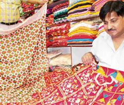 A trader displays delicate phulkari work in Patiala on Friday.
