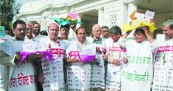 Leader of Opposition Jagdish Mukhi along with his colleagues in Delhi Legislative Assembly stage a dharna against price rise in the Vidhan Sabha complex in the Capital 