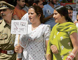 Computer teachers raise slogans in support of their demands at Gandhi Chowk, Hamirpur, on Friday.