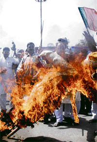 RSS activists burn an effigy of Keralas Communist government in protest against the attack on Hindus in Jammu on Saturday.