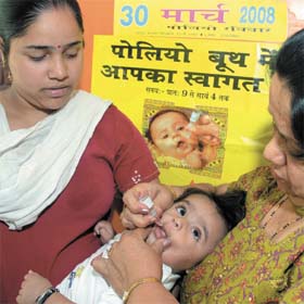 Pulse polio drops being administered to a child at Gole Market in the Capital