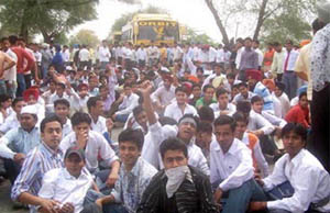 Students of Bhai Maha Singh Engineering College in Muktsar block highway after a bus hit a 2nd-year student, injuring him critically on Monday. 