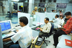 Bankers burn midnight oil on the intervening night of Monday and Tuesday, the last day of the financial year 2007-08, at State Bank of Patiala in Bathinda. 