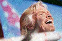 Virgin Blue founder and British entrepreneur Richard Branson laughs at a press conference in Sydney