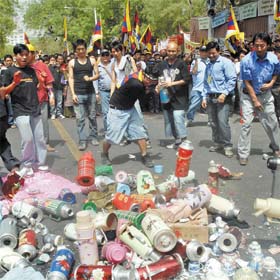 Tibetans in exile prepare to burn Chinese goods against the alleged atrocities of the Chinese authorities on Tibetan people, in the Capital