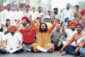 Activists of the RSS, Bajrang Dal and BJP protest at Kuhara Chowk on the Ludhiana-Chandigarh road on Monday.
