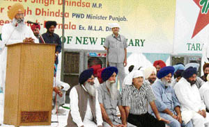 Sukhdev Singh Dhindsa addresses a gathering at Jitwal village near Ahmedgarh on Monday. 