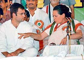 Congress party president Sonia Gandhi with her son and party general secretary Rahul Gandhi at the party's UP State Convention at Nanarao Park in Kanpur