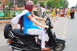 A woman is covered from head to toe while driving two- wheeler in Bathinda