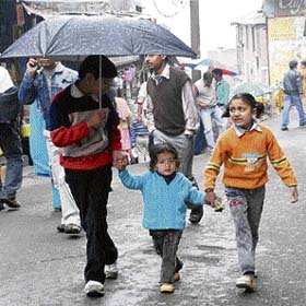 These children are caught unawares in a drizzle in Lower Bazar in Shimla on Tuesday evening