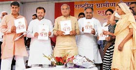 Haryana Chief Minister Bhupinder Singh Hooda (centre) launches the National Rural Employment Guarantee Scheme at Karnal