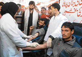 JKLF members donate blood at a blood donation camp organised by the front in memory of killed Kashmiri youths, in Srinagar on Tuesday.