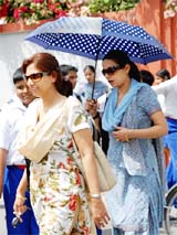 Under cover: Goggles and umbrellas are out in Bathinda as mercury has started to rise